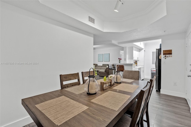 dining area with hardwood / wood-style floors