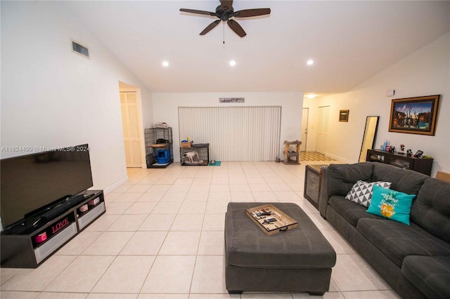 tiled living room with ceiling fan and lofted ceiling