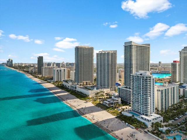 bird's eye view featuring a water view and a view of the beach