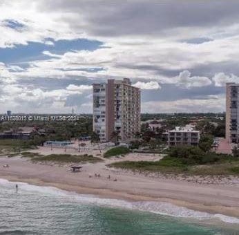 view of city featuring a view of the beach and a water view