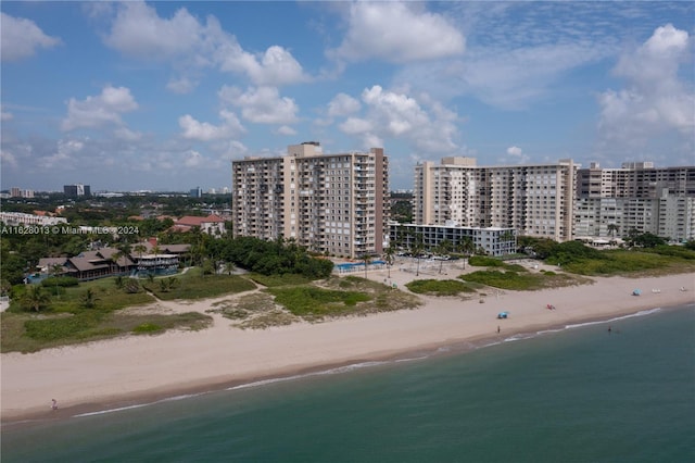 aerial view featuring a view of city, a water view, and a view of the beach