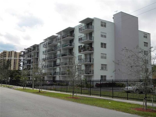 12500 NE 15th Ave Unit 207, North Miami, FL 33161 - view of building exterior with fence