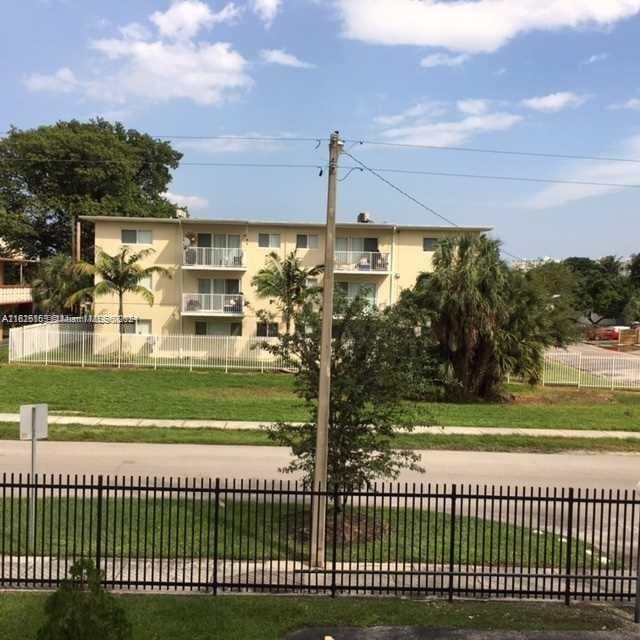 12500 NE 15th Ave Unit 207, North Miami, FL 33161 - view of home's community with a yard and fence