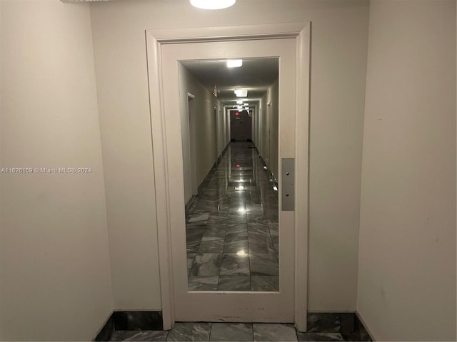 hallway featuring tile patterned floors