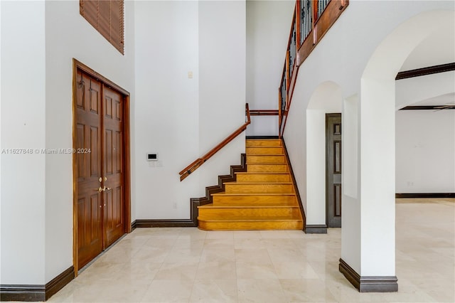 interior space with a towering ceiling