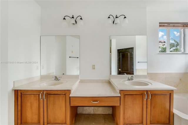 bathroom featuring a bath, tile patterned flooring, and vanity