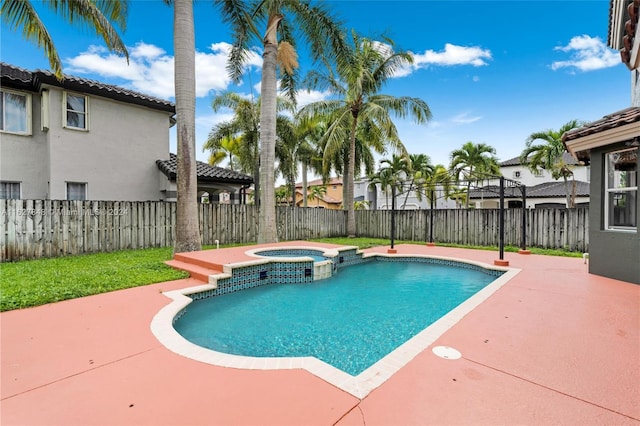 view of swimming pool featuring an in ground hot tub and a patio