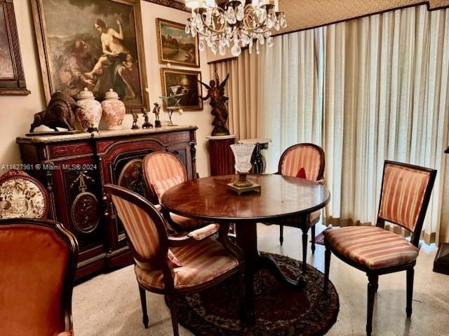 dining room featuring carpet floors and an inviting chandelier