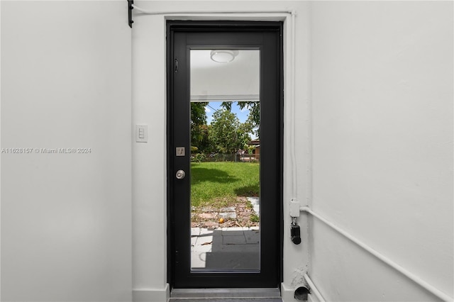 doorway to outside featuring a wealth of natural light