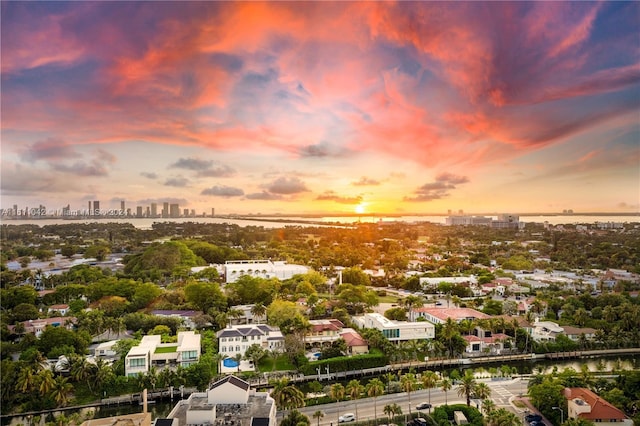 aerial view at dusk with a water view