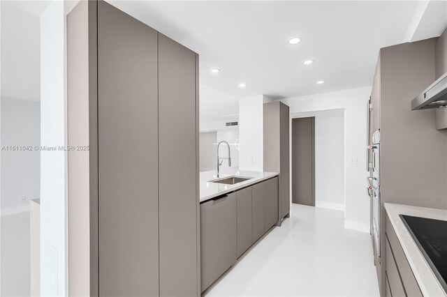 kitchen featuring black electric stovetop, gray cabinetry, wall chimney range hood, sink, and dishwasher