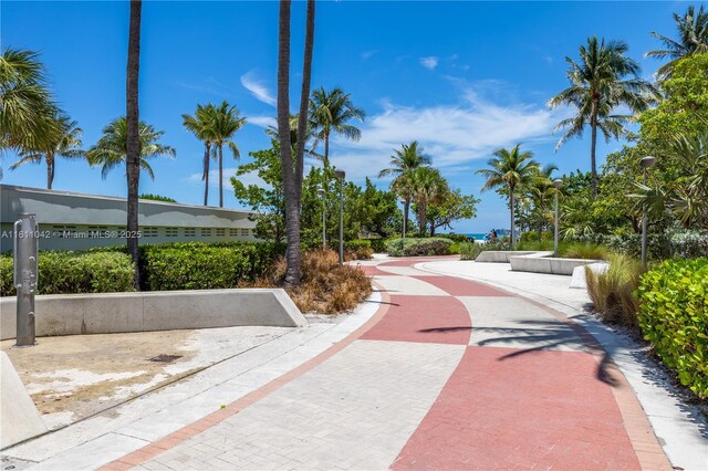 view of property's community featuring a view of the beach and a water view