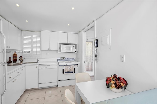 kitchen featuring white cabinetry, electric panel, white appliances, and light tile patterned floors