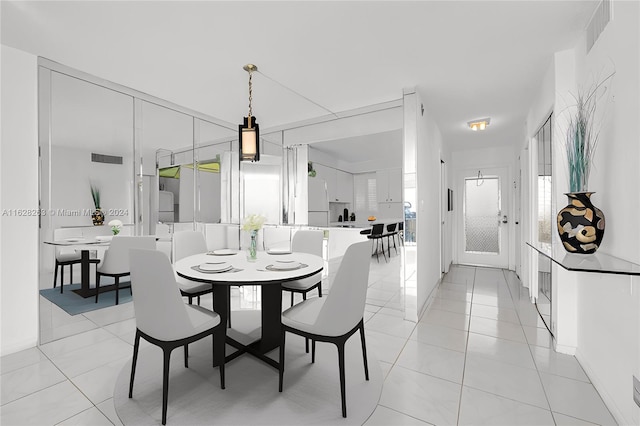 dining area with light tile patterned floors