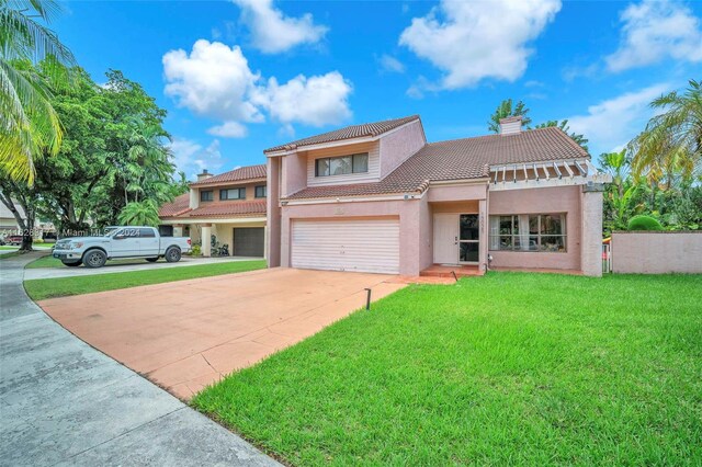 mediterranean / spanish house with a front lawn