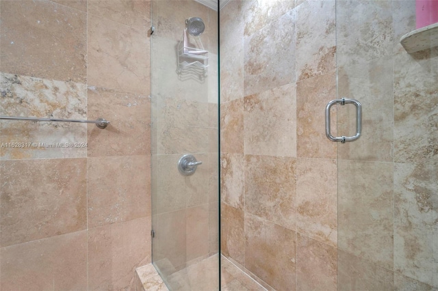 full bath with a shower stall