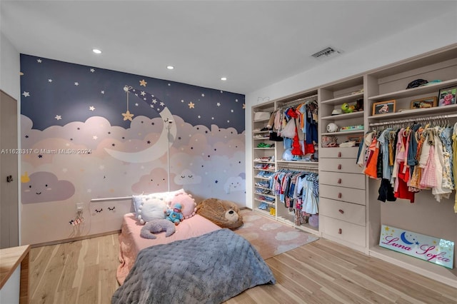 bedroom featuring visible vents, wood finished floors, and recessed lighting