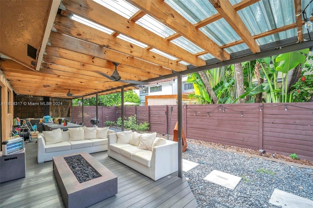 exterior space featuring a fenced backyard and an outdoor living space with a fire pit