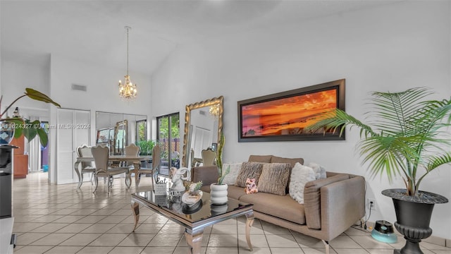 tiled living room featuring an inviting chandelier and high vaulted ceiling