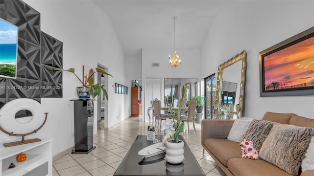 living room with a wealth of natural light, light tile patterned floors, high vaulted ceiling, and a chandelier