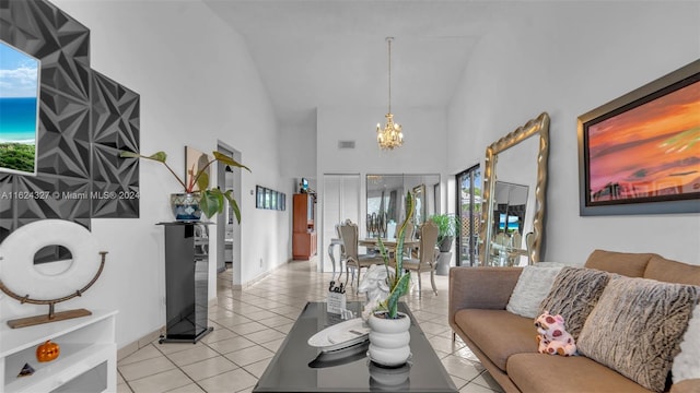 living room featuring light tile patterned floors, high vaulted ceiling, and a chandelier