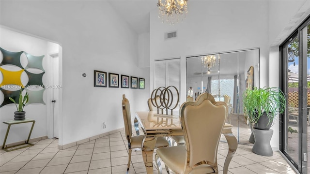 dining area featuring an inviting chandelier, plenty of natural light, light tile patterned floors, and high vaulted ceiling