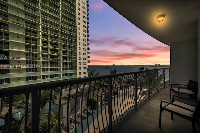 view of balcony at dusk