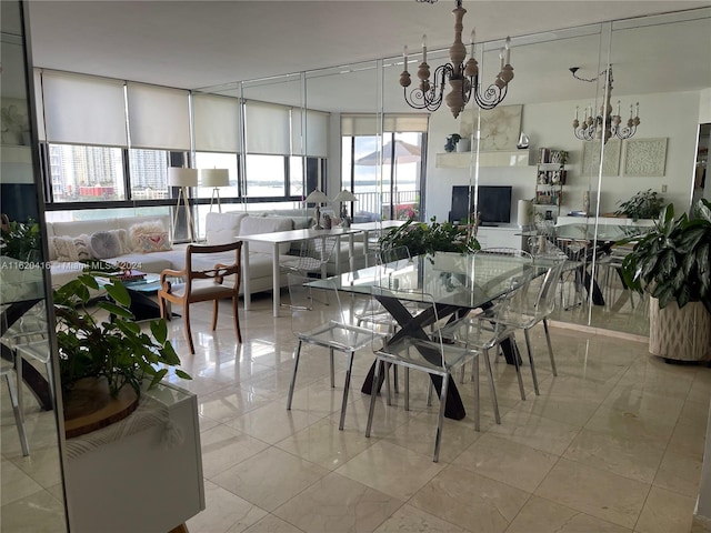 dining space with a notable chandelier and light tile patterned floors