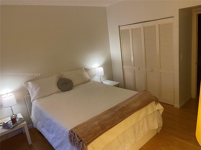 bedroom featuring a closet and hardwood / wood-style flooring