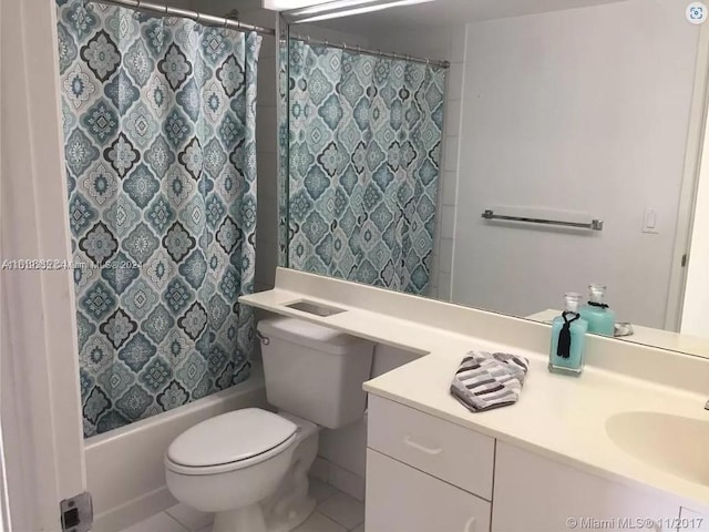 full bathroom featuring tile patterned floors, vanity, shower / bath combo, and toilet