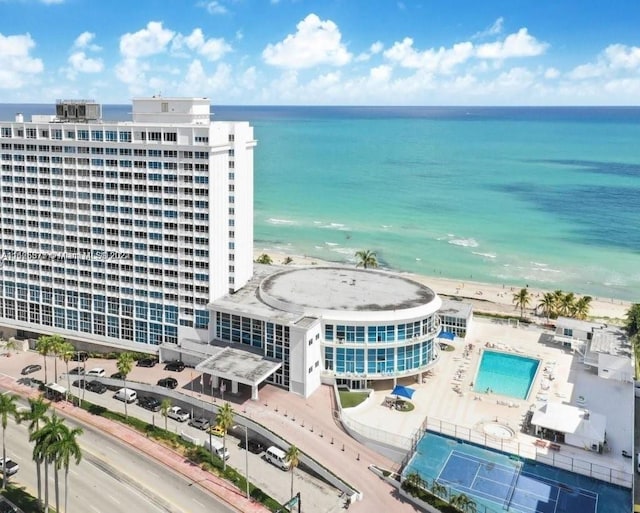 aerial view featuring a water view and a beach view