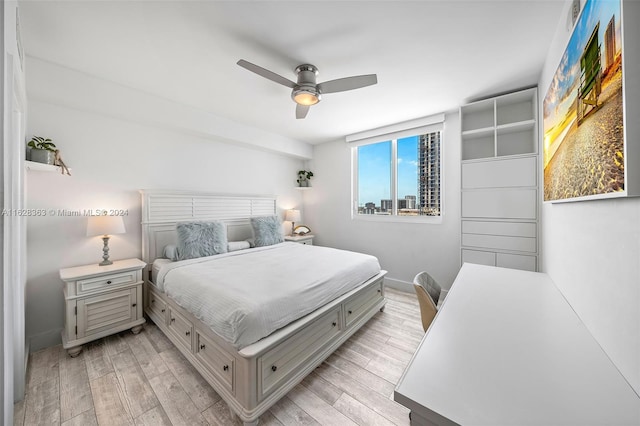 bedroom featuring ceiling fan and light hardwood / wood-style flooring