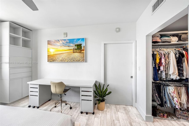 bedroom featuring a closet and light hardwood / wood-style flooring