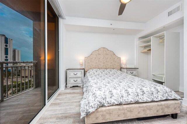 bedroom featuring ceiling fan, a closet, and light wood-type flooring