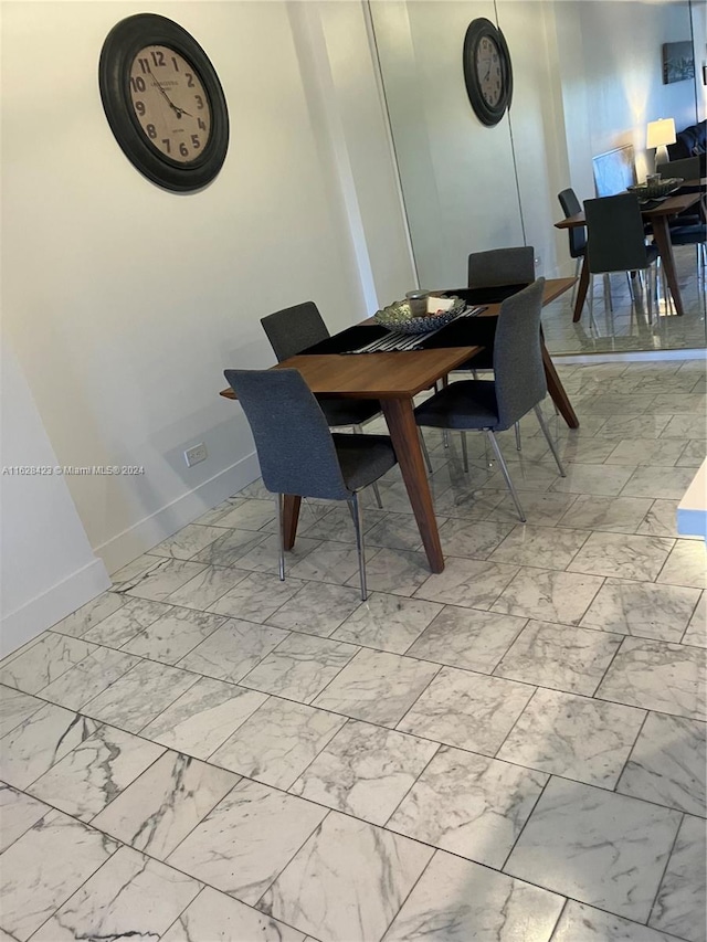 dining area featuring light tile patterned floors