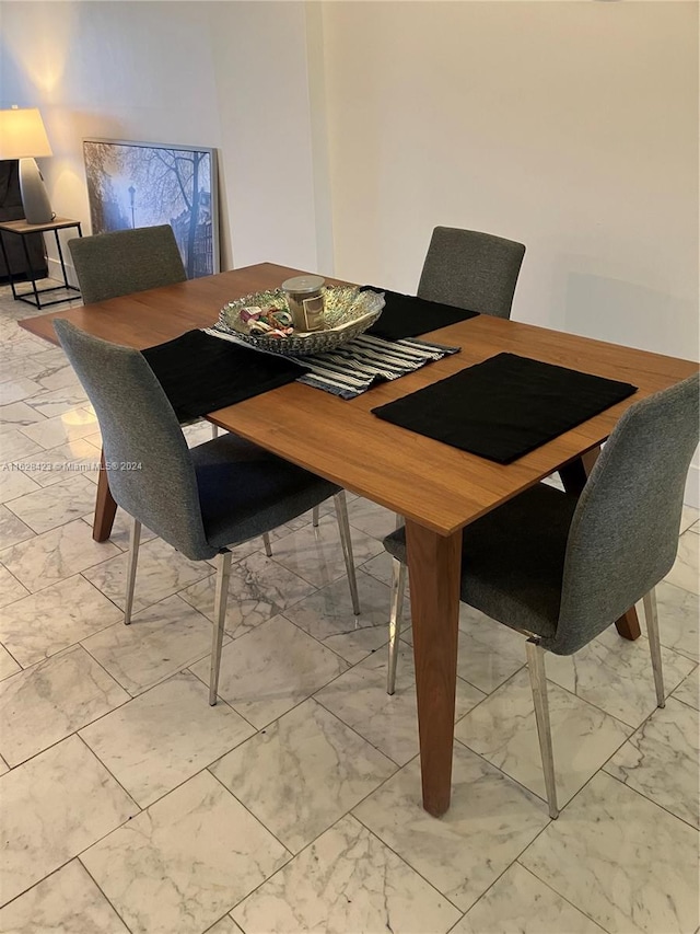 dining space with light tile patterned flooring