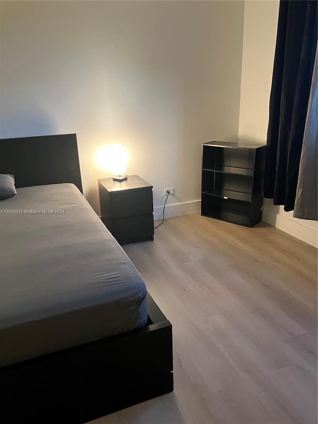 bedroom with light wood-type flooring