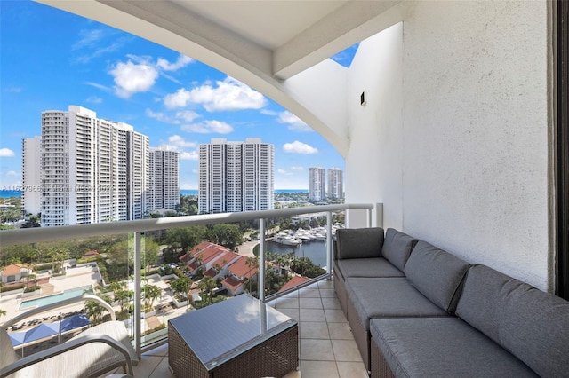 balcony featuring an outdoor hangout area and a water view