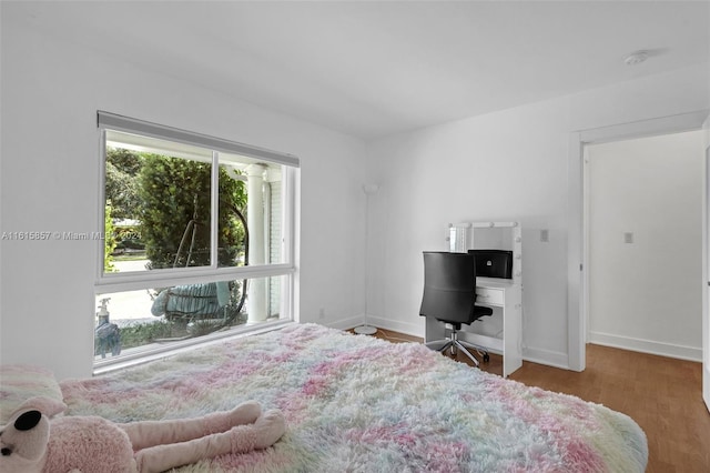 bedroom with hardwood / wood-style flooring