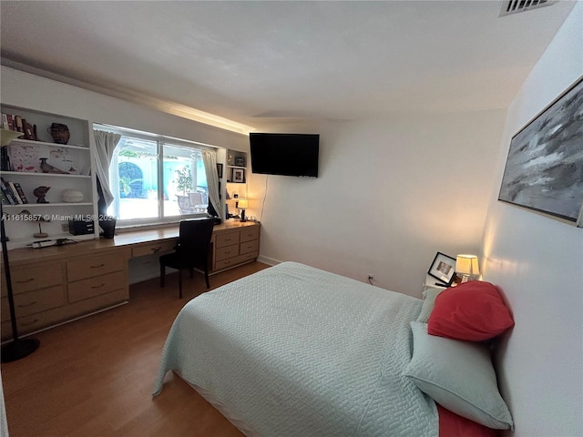 bedroom featuring hardwood / wood-style flooring