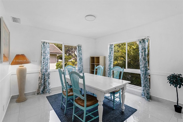 dining room featuring light tile patterned flooring