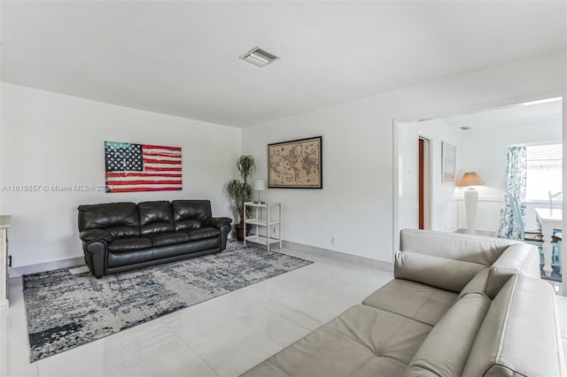 living room with light tile patterned flooring