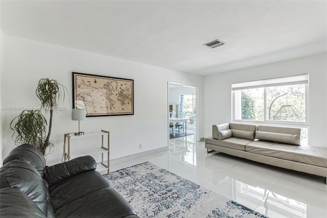 living room with light tile patterned flooring