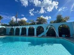 view of pool featuring a water slide