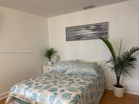 bedroom featuring wood-type flooring