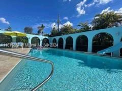 view of pool featuring a water slide