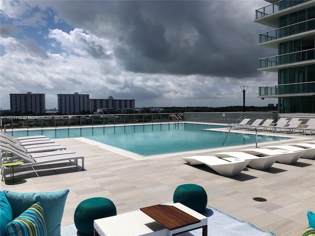 view of swimming pool featuring a patio area