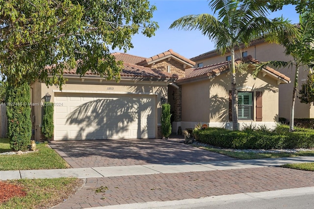 mediterranean / spanish house featuring a garage