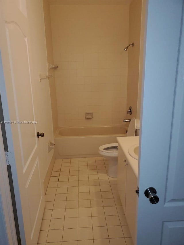 full bathroom with toilet, tiled shower / bath combo, and vanity