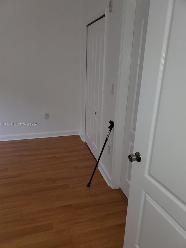 1666 SE 27th Ct Unit 108, Florida City, FL 33035 - empty room with light wood-style floors and baseboards